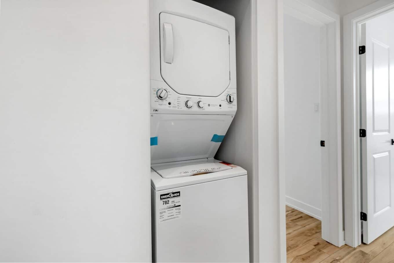 washer and dryer in hallway closet